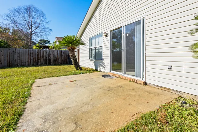 a view of backyard with swimming pool
