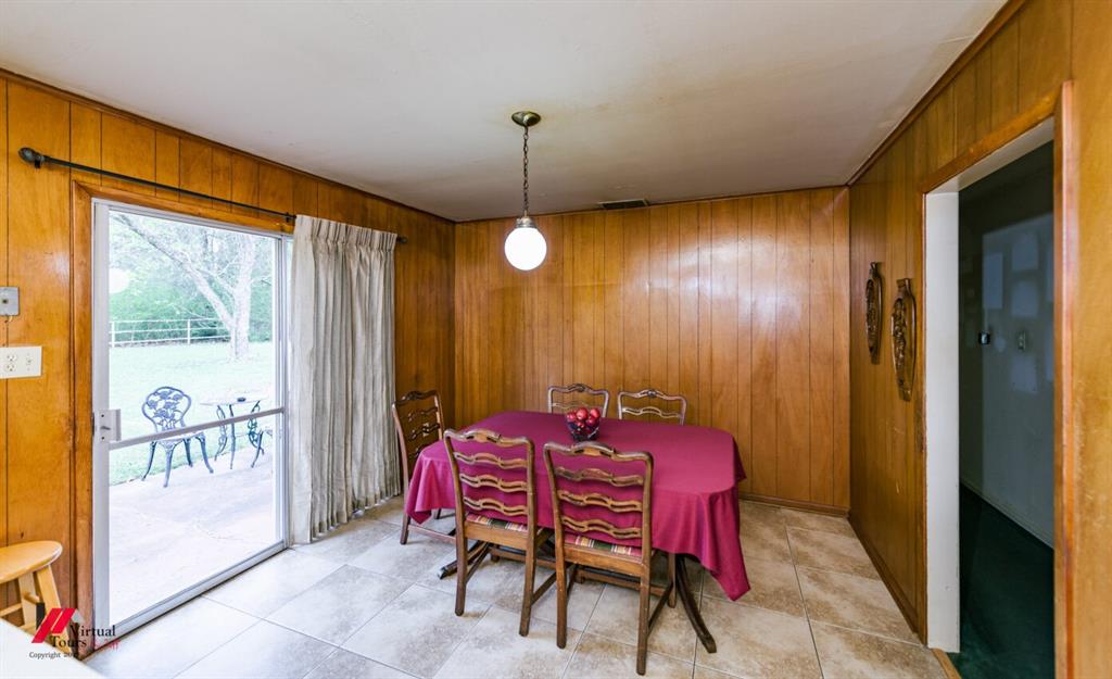 6103 Colquitt Road Keithville, LA 71047 - Photo 18 of 34 a dining room with furniture and window