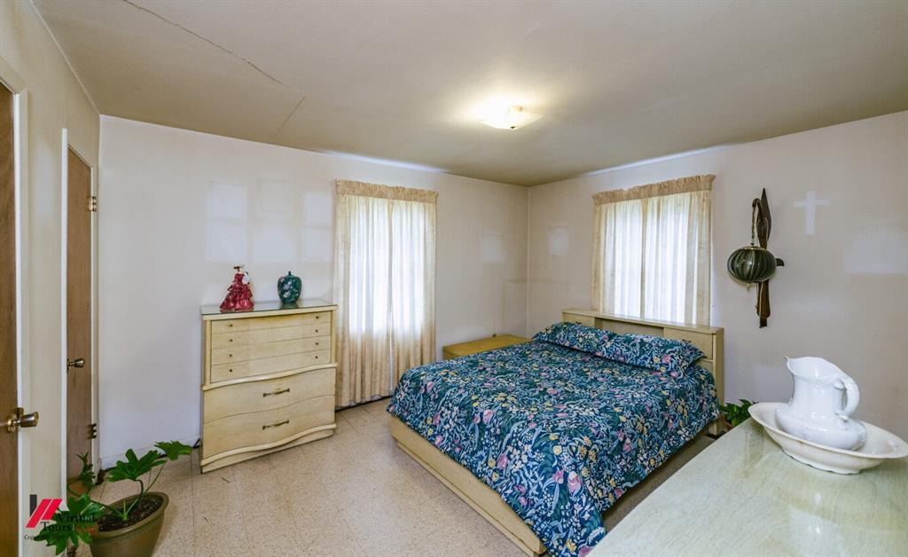 6103 Colquitt Road Keithville, LA 71047 - Photo 21 of 34 a bedroom with a bed and a dresser