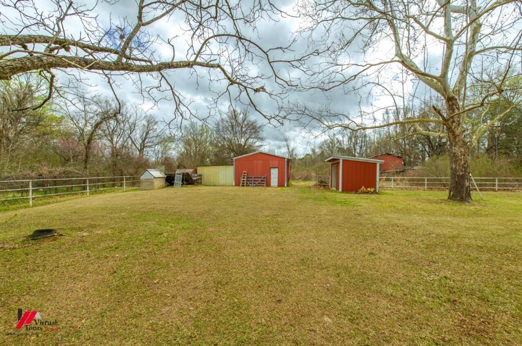 6103 Colquitt Road Keithville, LA 71047 - Photo 29 of 34 a house view with swimming pool