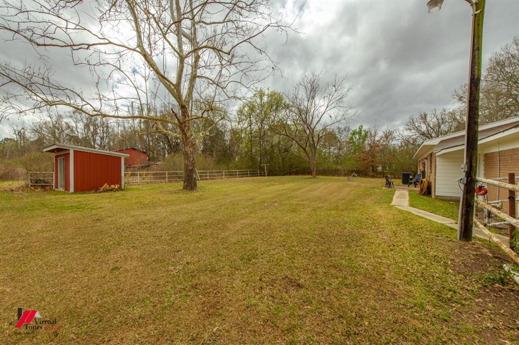 6103 Colquitt Road Keithville, LA 71047 - Photo 33 of 34 a view of a yard with an outdoor space