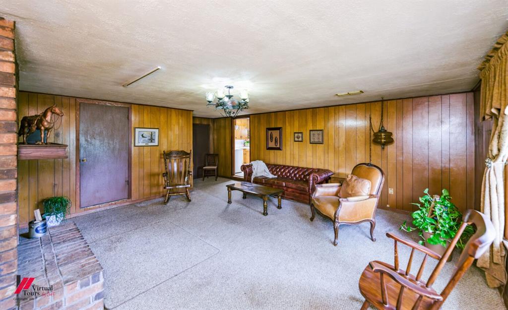6103 Colquitt Road Keithville, LA 71047 - Photo 8 of 34 a living room with furniture and a chandelier