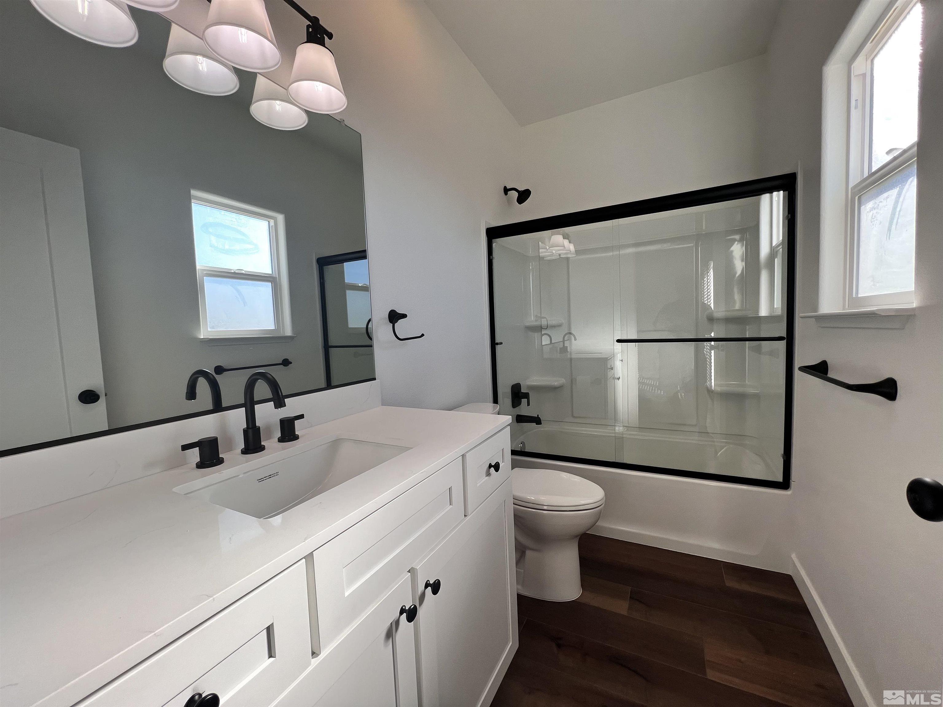 682 Silver Spur Drive Fallon, NV 89406 - Photo 15 of 29 a bathroom with a sink a toilet and shower