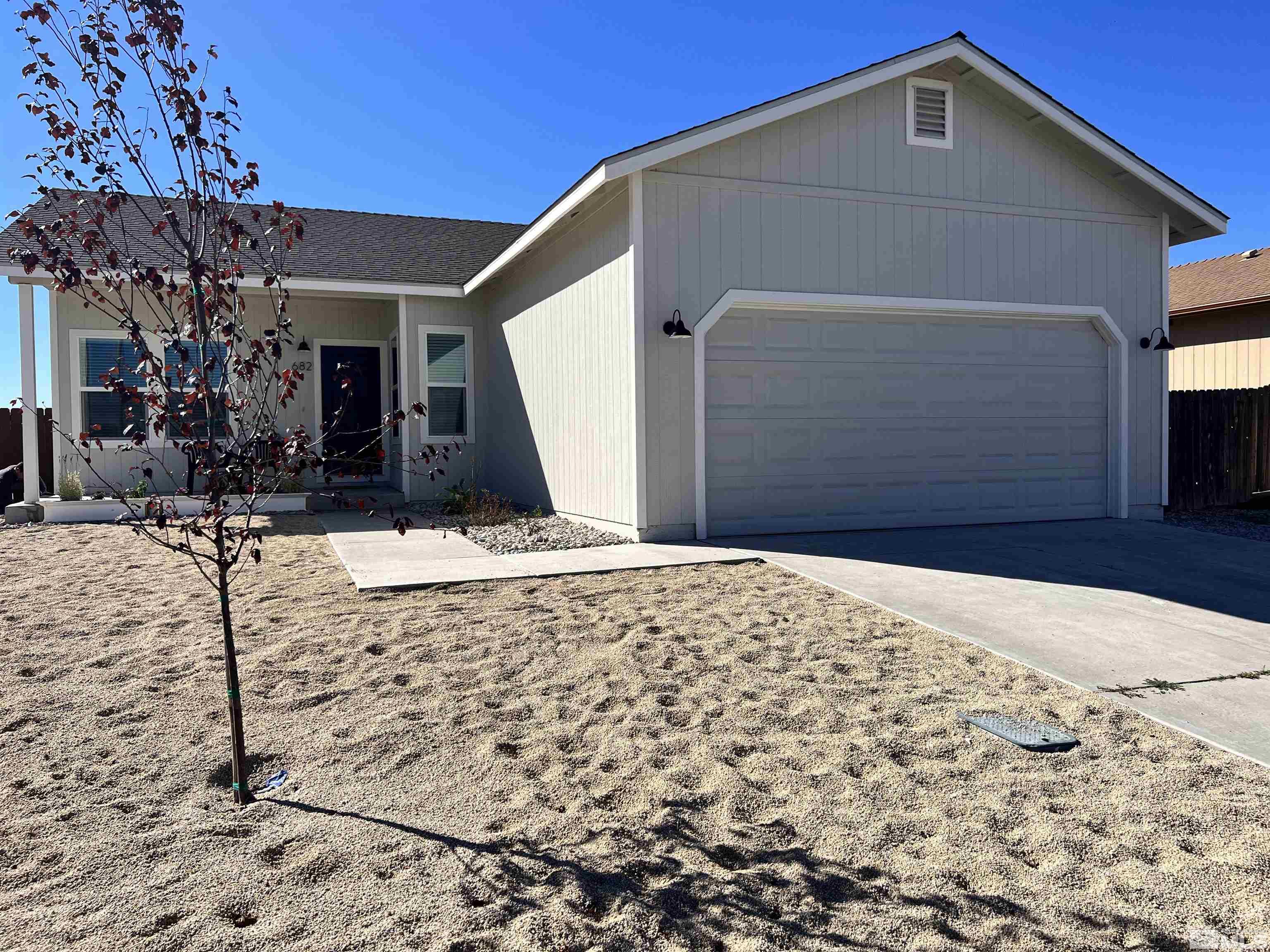682 Silver Spur Drive Fallon, NV 89406 - Photo 2 of 29 a front view of a house