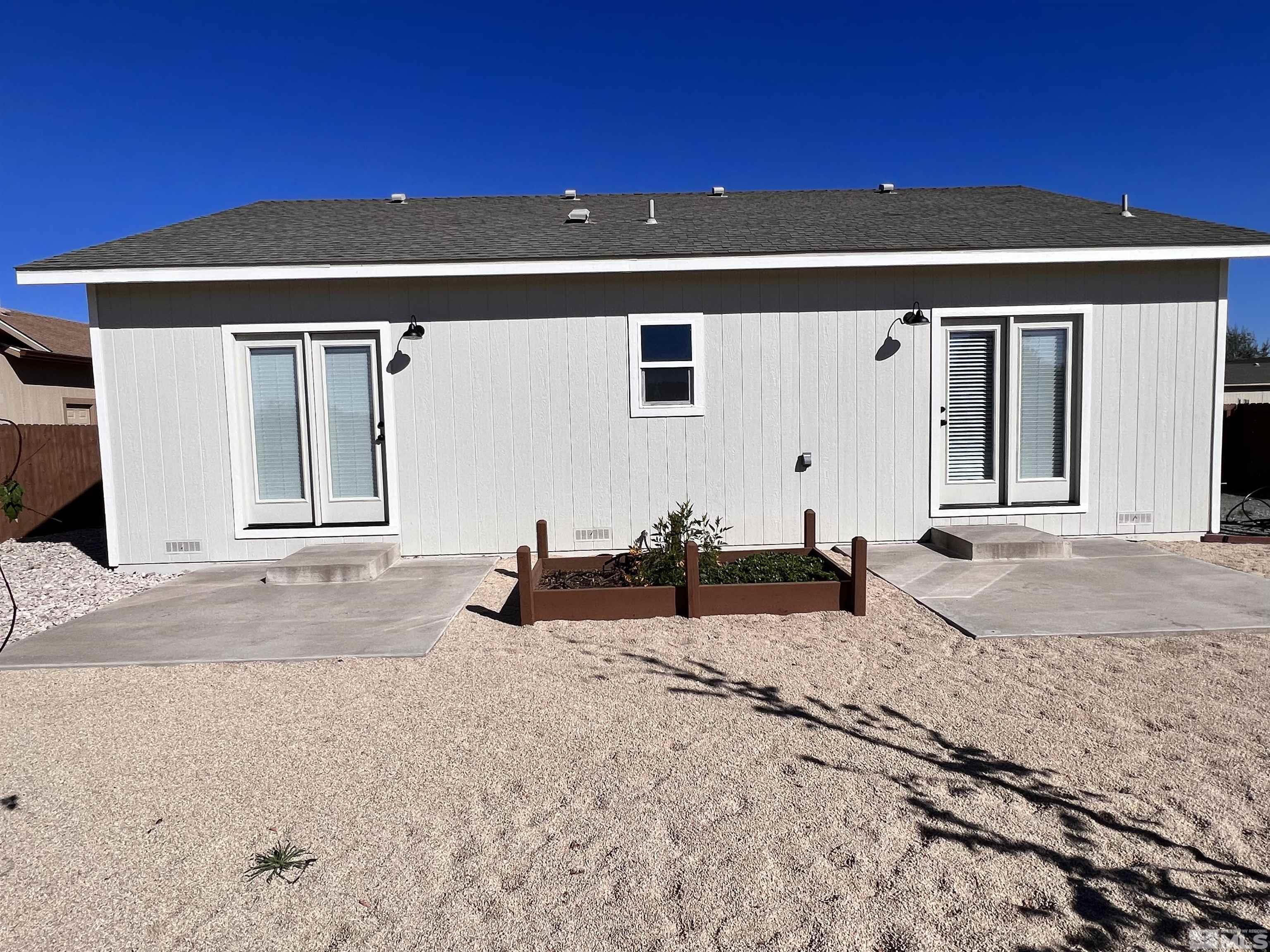 682 Silver Spur Drive Fallon, NV 89406 - Photo 24 of 29 a front view of a house with a yard