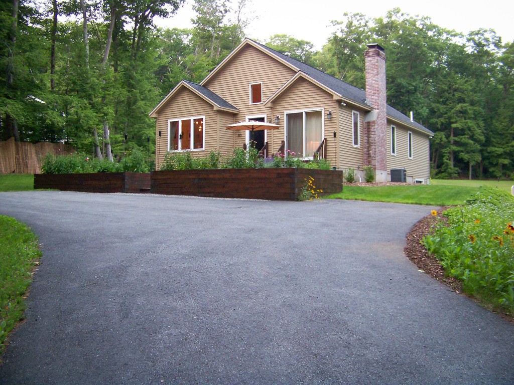 80 Rindge Turnpike Ashburnham, MA 01430 - Photo 1 of 30 a front view of a house with a yard and garage