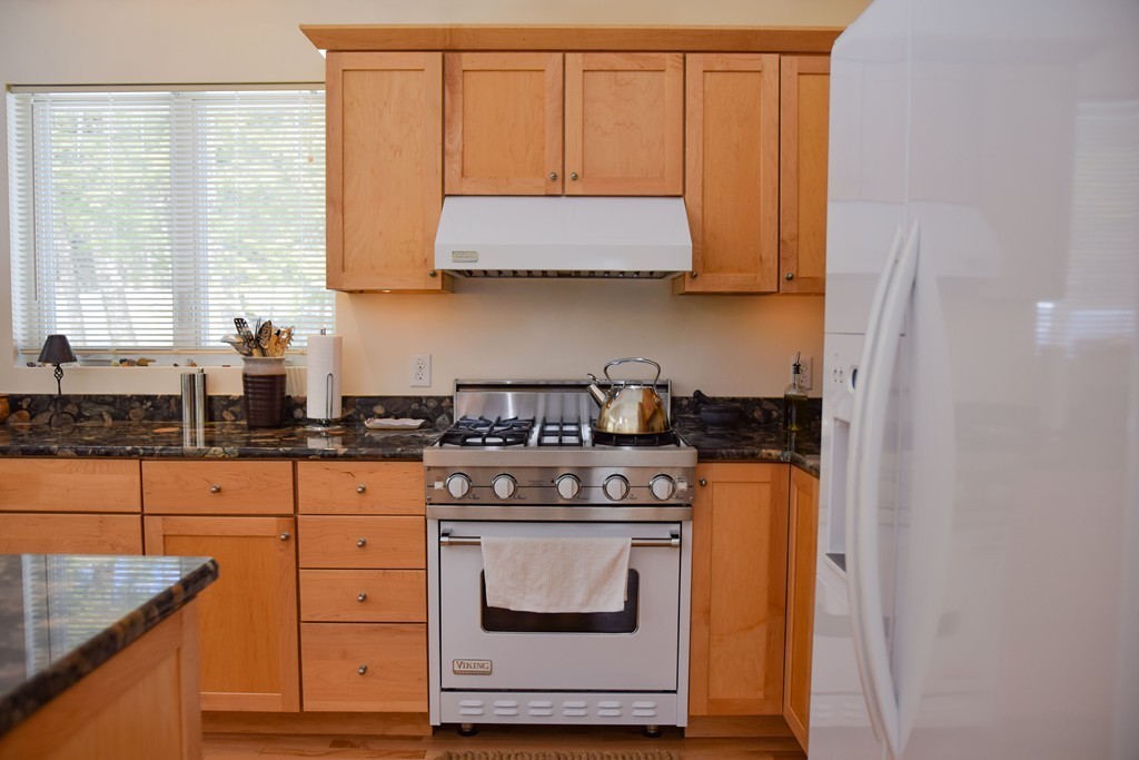 80 Rindge Turnpike Ashburnham, MA 01430 - Photo 15 of 30 a kitchen with stainless steel appliances granite countertop a stove a sink and a microwave