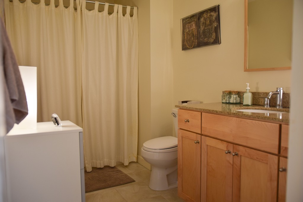 80 Rindge Turnpike Ashburnham, MA 01430 - Photo 24 of 30 a bathroom with a sink a toilet and a mirror