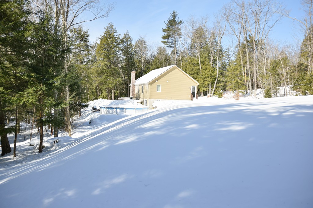 80 Rindge Turnpike Ashburnham, MA 01430 - Photo 6 of 30 a view of a house with a yard and garage