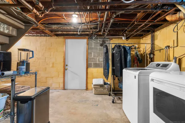 a view of a patio with table and chairs and potted plants