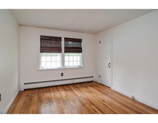 84 Dudley Road Sudbury, MA 01776 - Photo 12 of 17 a view of an empty room with wooden floor and a window