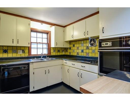 84 Dudley Road Sudbury, MA 01776 - Photo 5 of 17 a kitchen with stainless steel appliances granite countertop a sink and cabinets