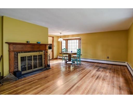 84 Dudley Road Sudbury, MA 01776 - Photo 8 of 17 a view of empty room with wooden floor and fireplace