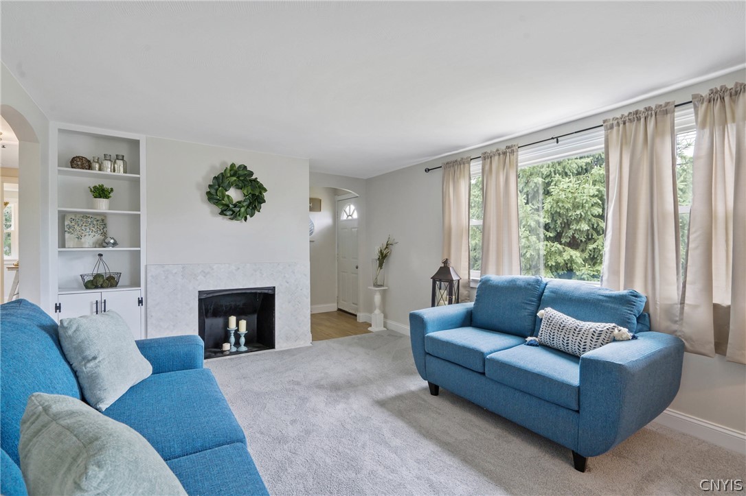 6130 South Bay Road Cicero, NY 13039 - Photo 4 of 30 This generous room offers versatility for seating arrangements and is visually anchored by the beautiful marble mosaic fireplace.