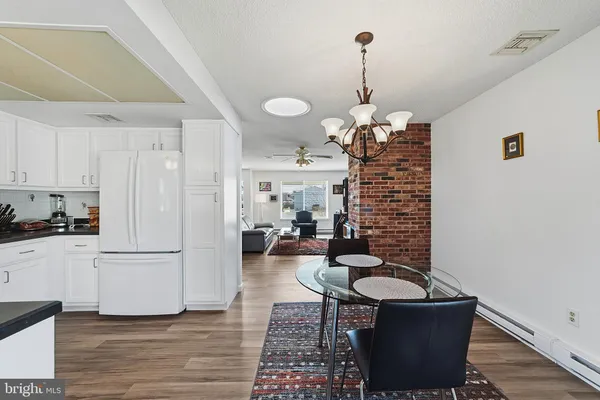 a living room with furniture a table and chairs