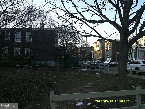 a view of patio with chairs and potted plants