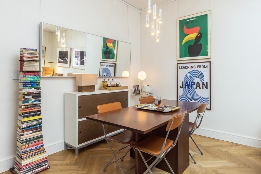 2 Clarendon Street, Unit 203 Boston, MA 02116 - Photo 4 of 7 a view of a dining room with furniture and wooden floor