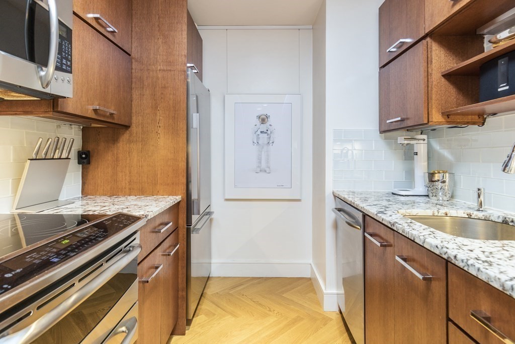 2 Clarendon Street, Unit 203 Boston, MA 02116 - Photo 5 of 7 a kitchen that has a sink and a stove