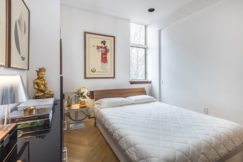 2 Clarendon Street, Unit 203 Boston, MA 02116 - Photo 6 of 7 a bedroom with a bed and a window