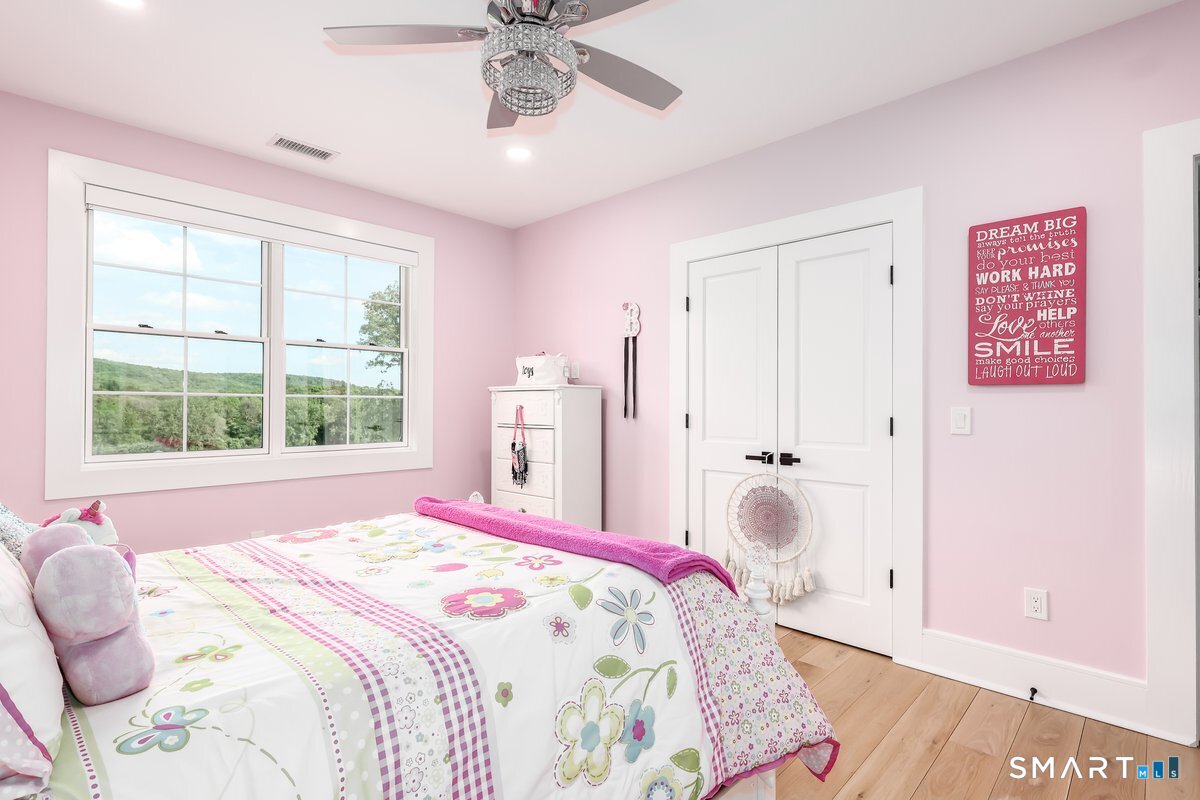 2 Pond View Lane Sherman, CT 06784 - Photo 28 of 40 a bedroom with a bed and a window
