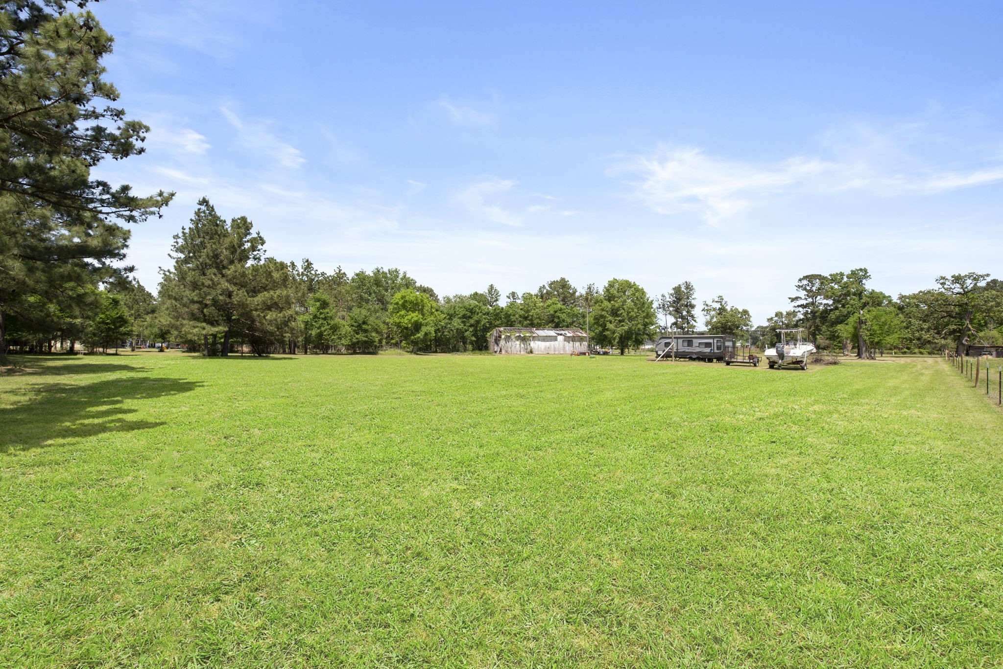 2814 Farm To Market Road 356 Trinity, TX 75862 - Photo 12 of 39 a view of a green field with wooden fence