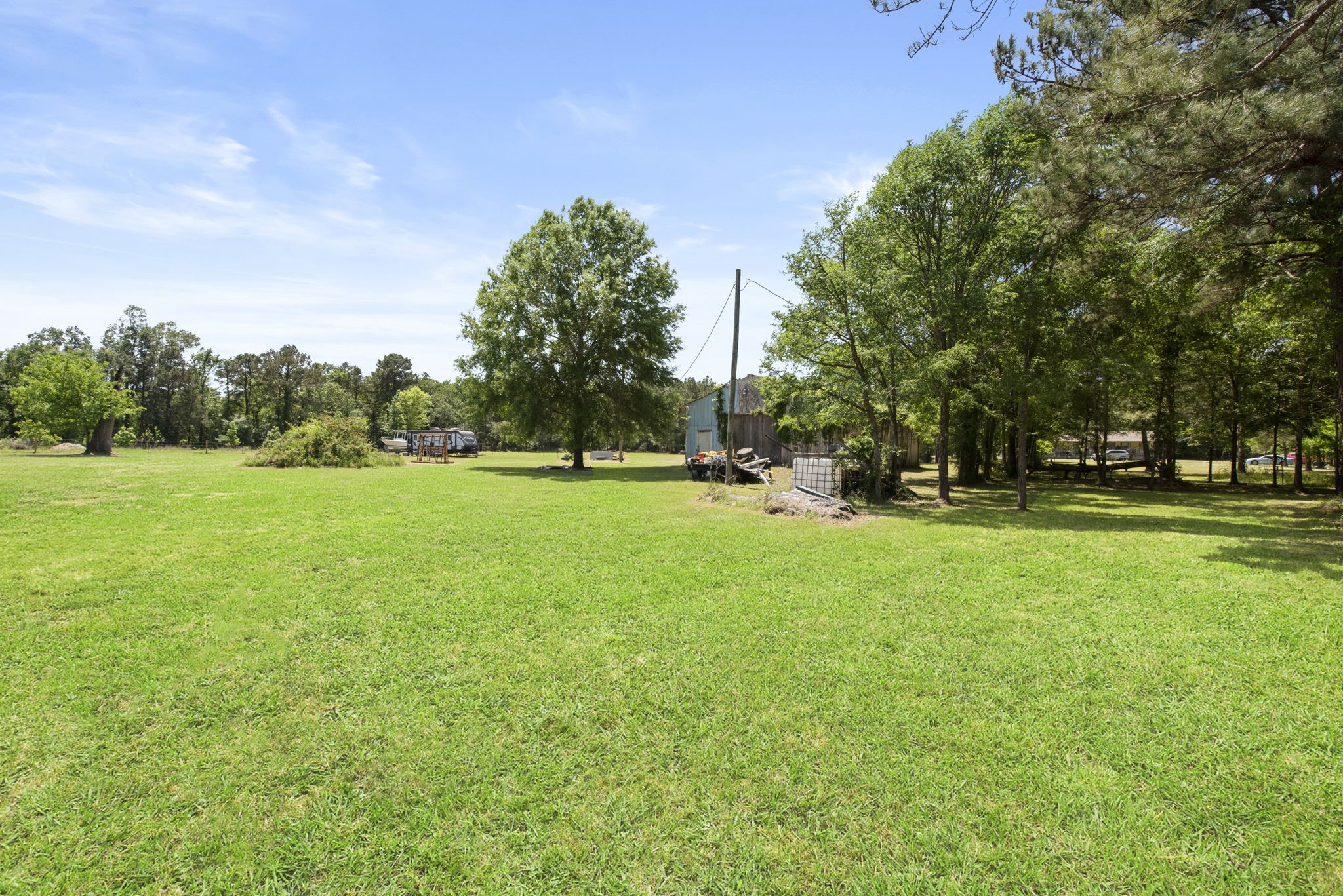 2814 Farm To Market Road 356 Trinity, TX 75862 - Photo 19 of 39 a view of grassy field with benches and trees all around