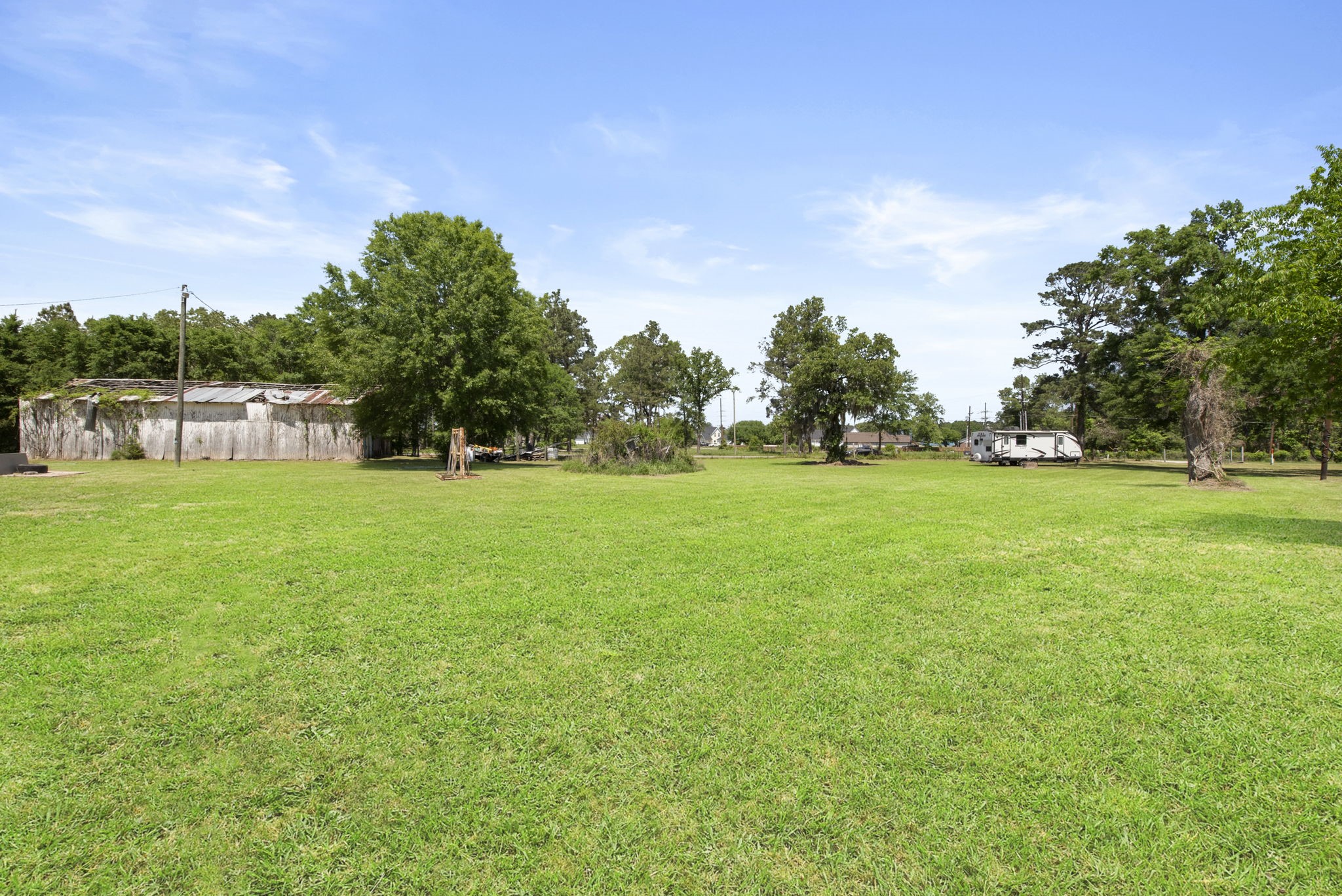 2814 Farm To Market Road 356 Trinity, TX 75862 - Photo 21 of 39 a backyard of a house with lots of green space and garden