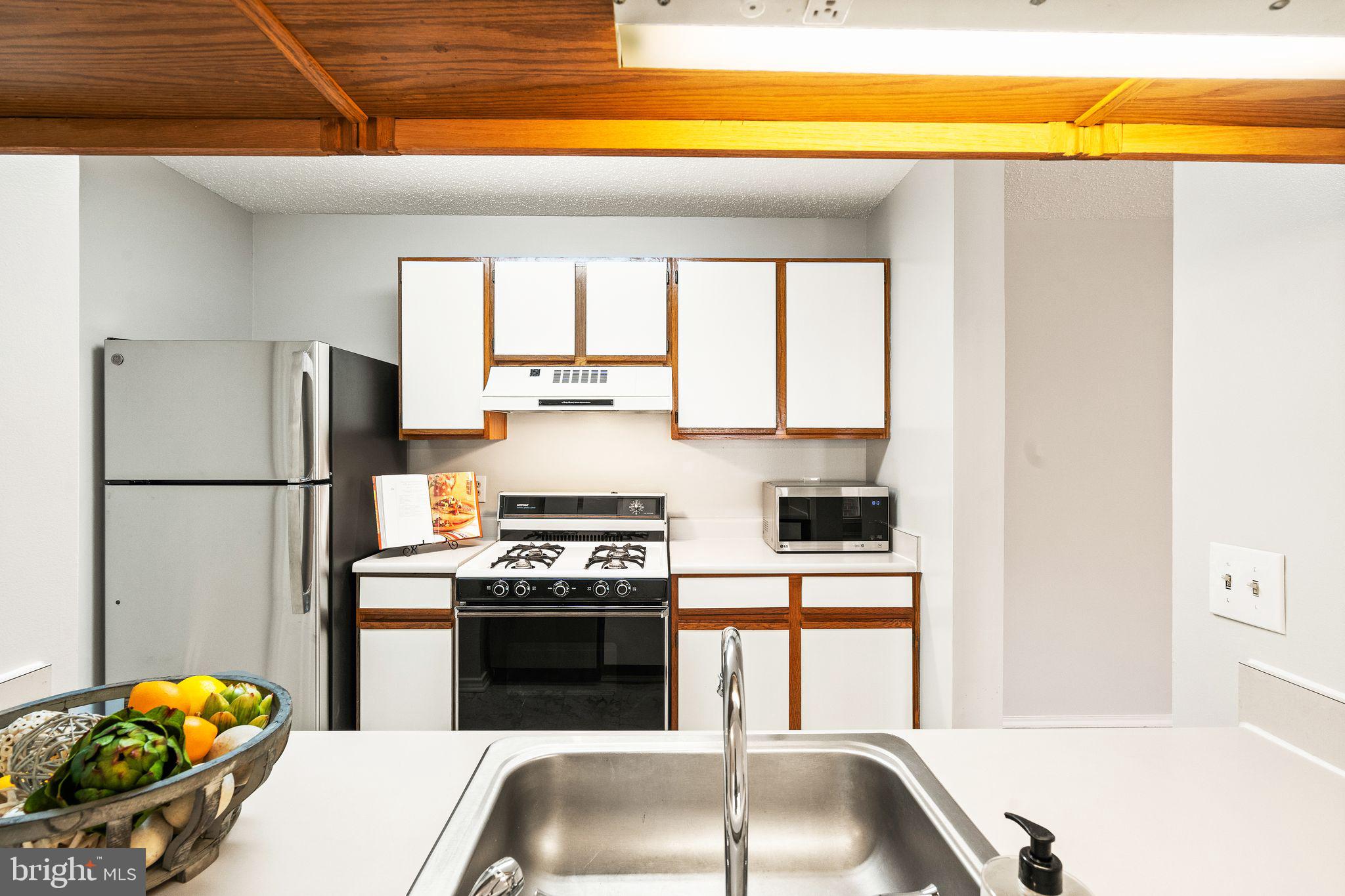 20951 Timber Ridge Terrace, Unit 304 Ashburn, VA 20147 - Photo 17 of 38 view into Kitchen
