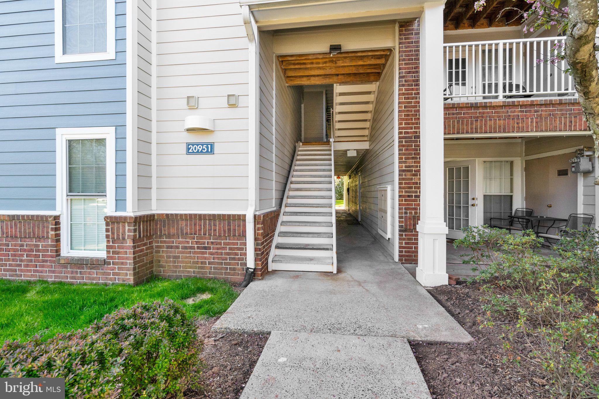 20951 Timber Ridge Terrace, Unit 304 Ashburn, VA 20147 - Photo 2 of 38 Front of building