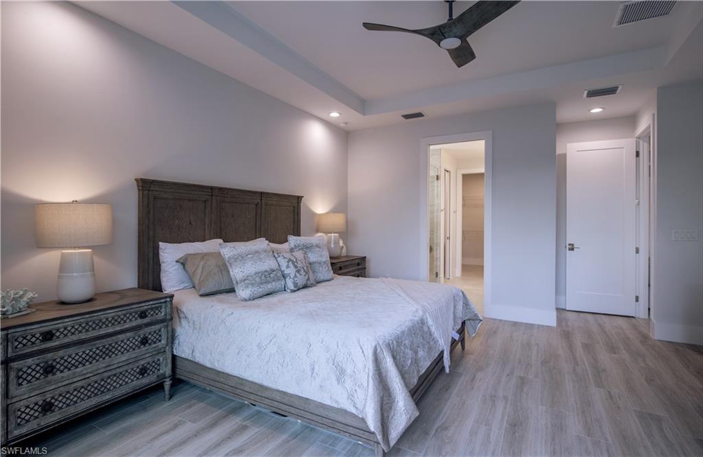 662 105th Avenue North Naples, FL 34108 - Photo 14 of 35 Bedroom with visible vents and light wood-style floors