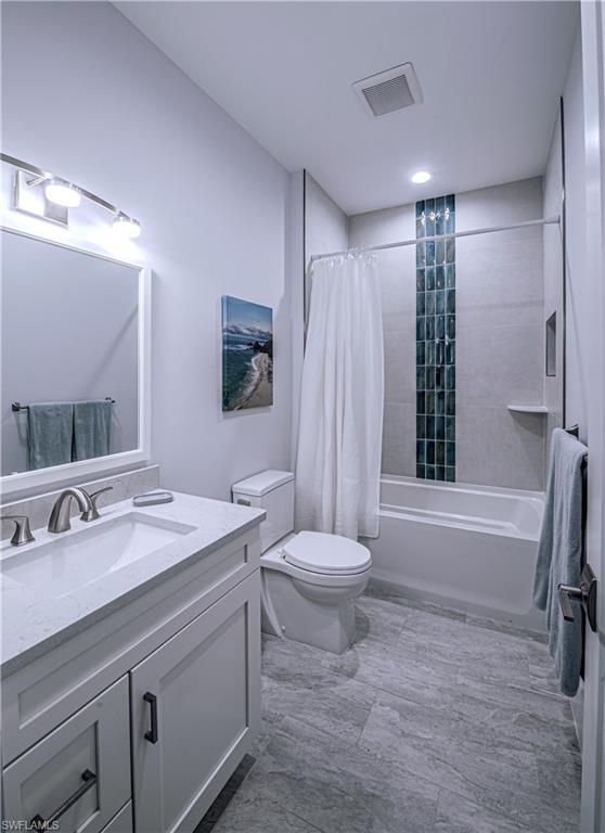 662 105th Avenue North Naples, FL 34108 - Photo 19 of 35 Full bathroom featuring toilet, vanity, shower / tub combo with curtain, and visible vents