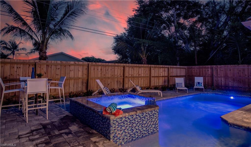 662 105th Avenue North Naples, FL 34108 - Photo 34 of 35 View of pool featuring a patio area, a pool with connected hot tub, and a fenced backyard