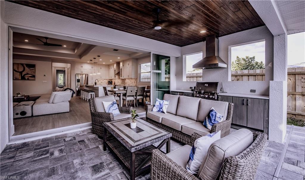 662 105th Avenue North Naples, FL 34108 - Photo 4 of 35 Living area with wood ceiling and a ceiling fan