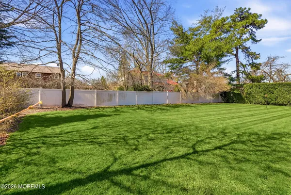 an aerial view of a house with a yard basket ball court and outdoor seating