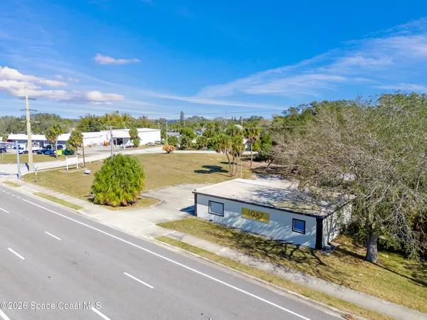 a view of a swimming pool with a yard