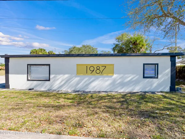 a view of a swimming pool with an outdoor space and seating area