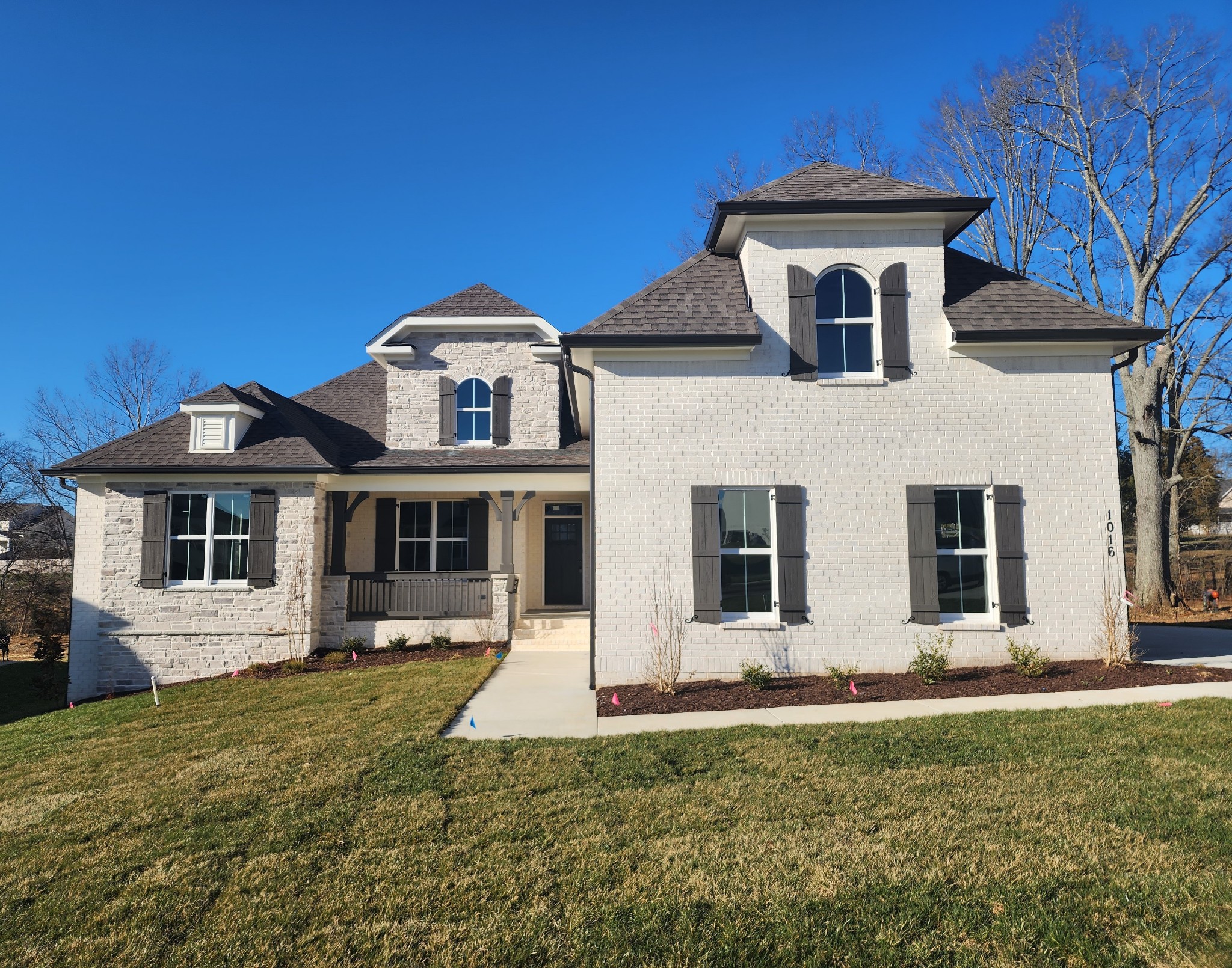 a front view of a house with garden