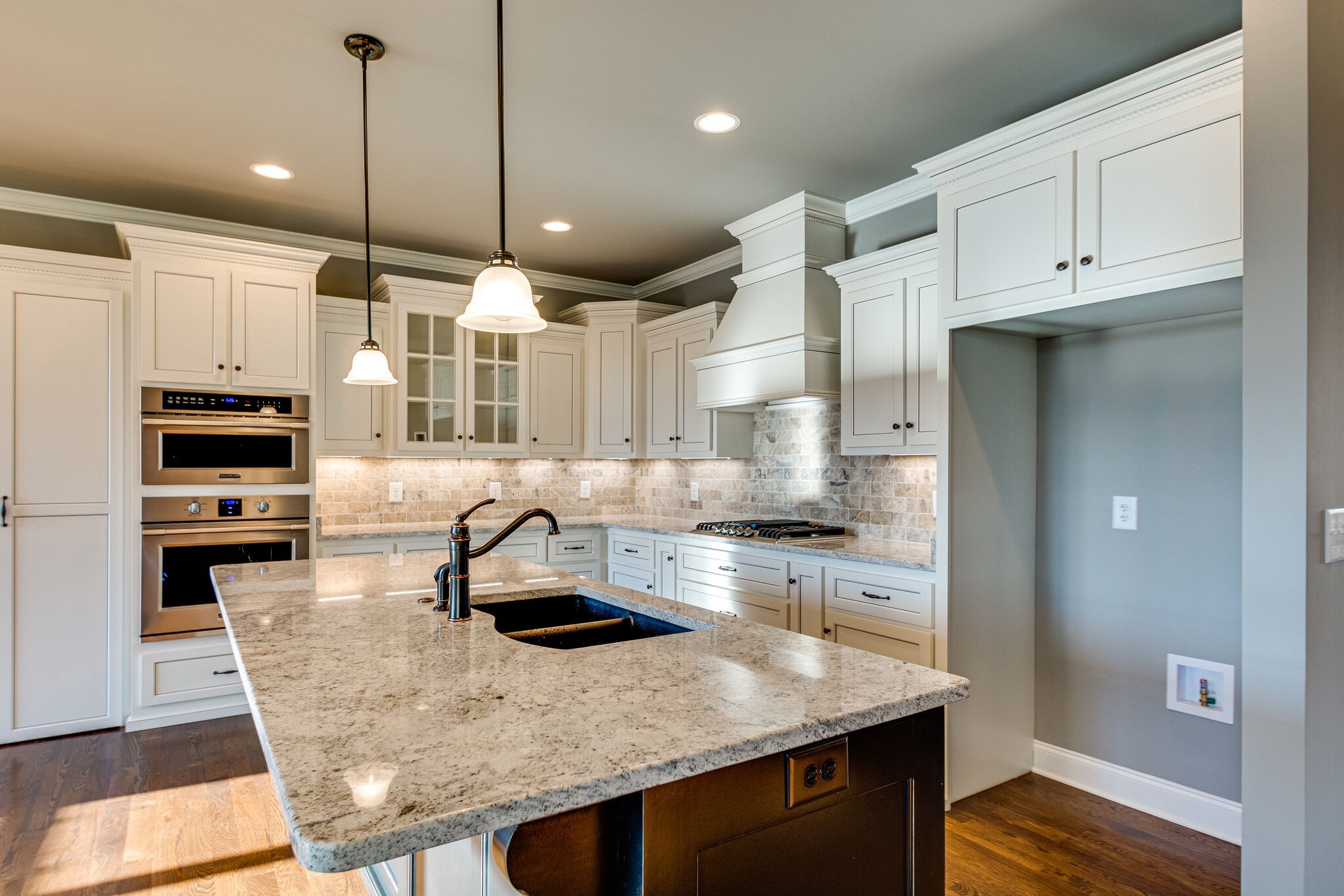 1016 Abbey Rd Way Spring Hill, TN 37174 - Photo 12 of 44 a kitchen with stainless steel appliances granite countertop a sink a stove and a refrigerator