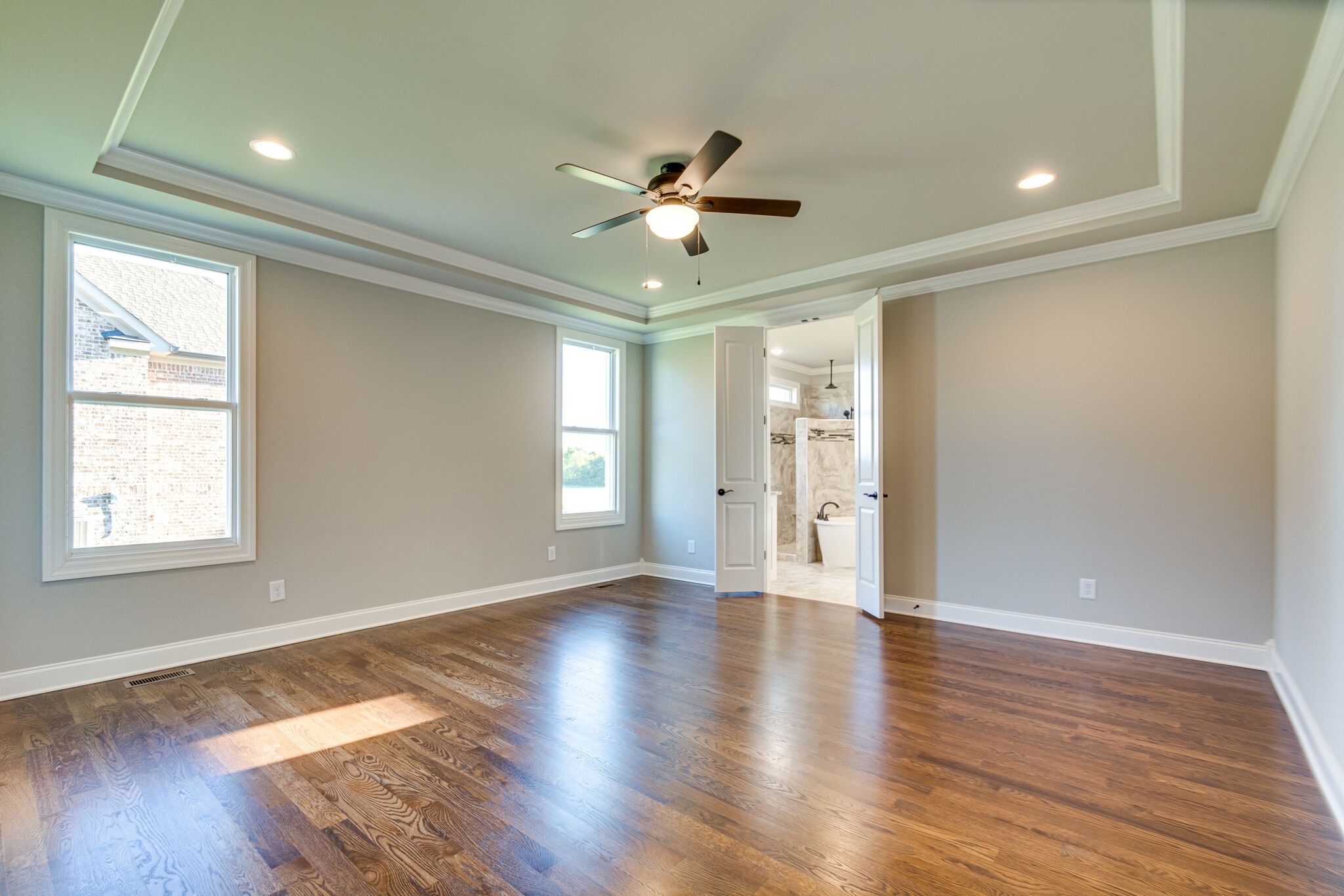 1016 Abbey Rd Way Spring Hill, TN 37174 - Photo 17 of 44 a view of an empty room with window and wooden floor
