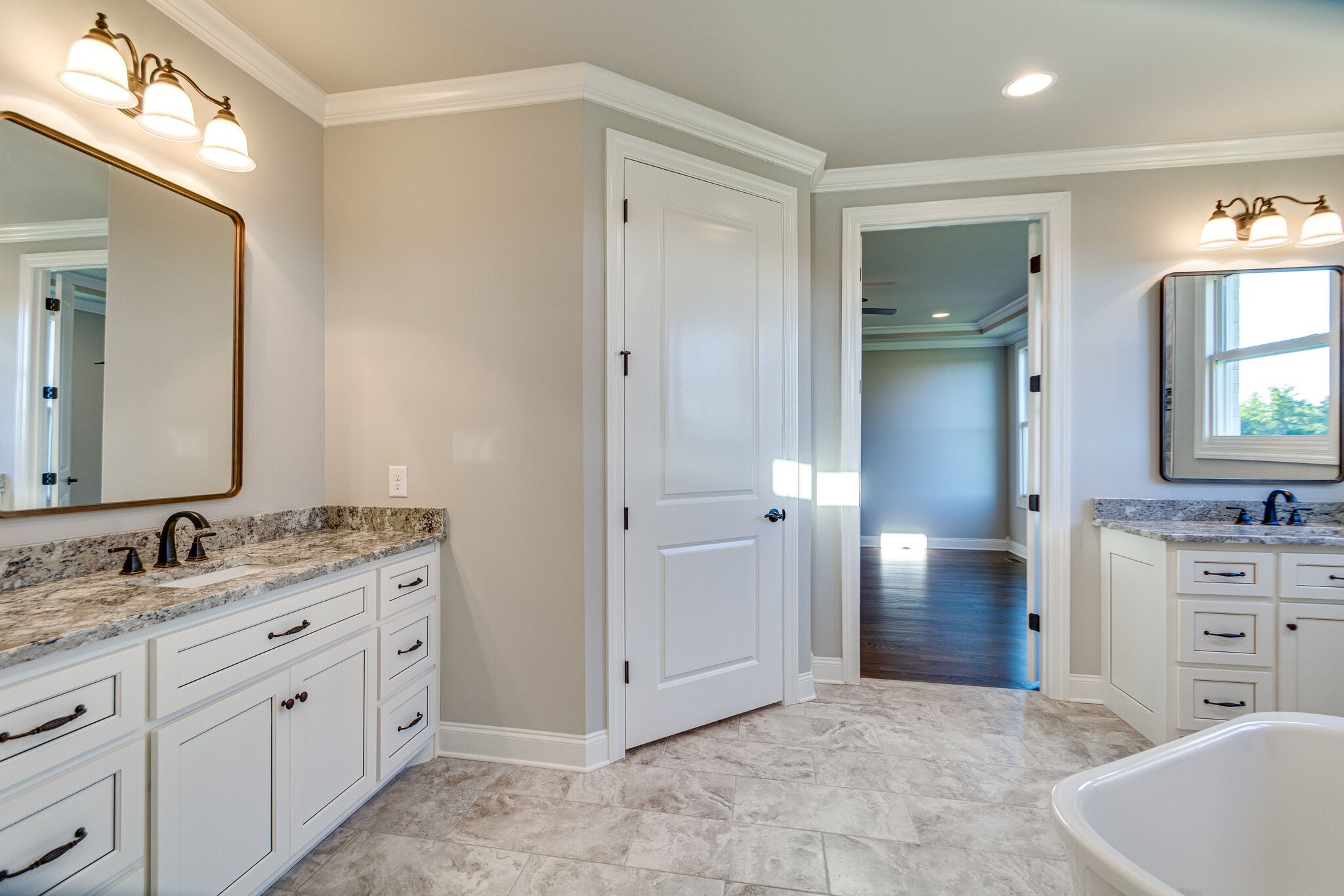 1016 Abbey Rd Way Spring Hill, TN 37174 - Photo 20 of 44 a spacious bathroom with a granite countertop sink and a mirror
