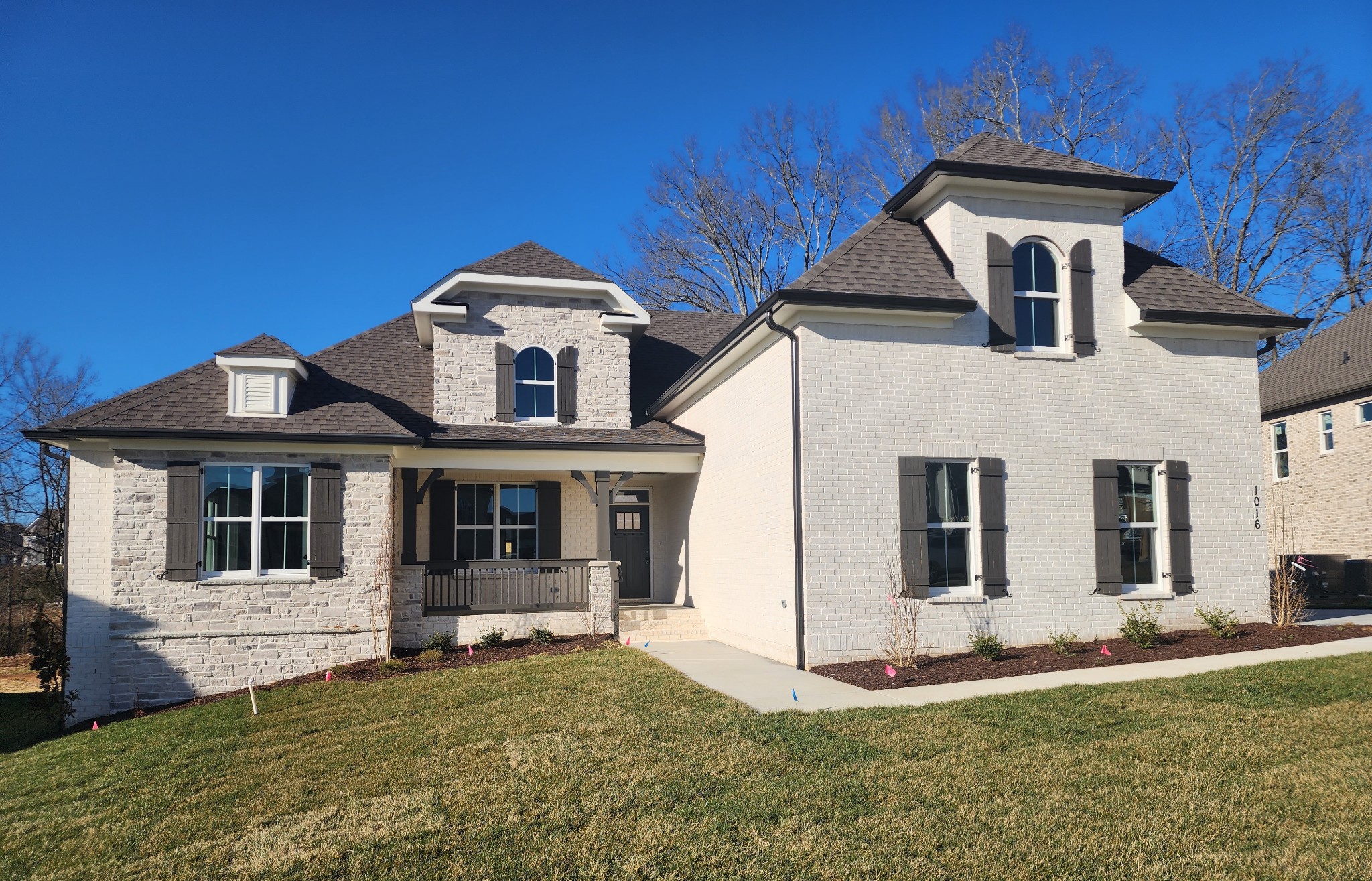 1016 Abbey Rd Way Spring Hill, TN 37174 - Photo 2 of 44 a front view of a house with a yard