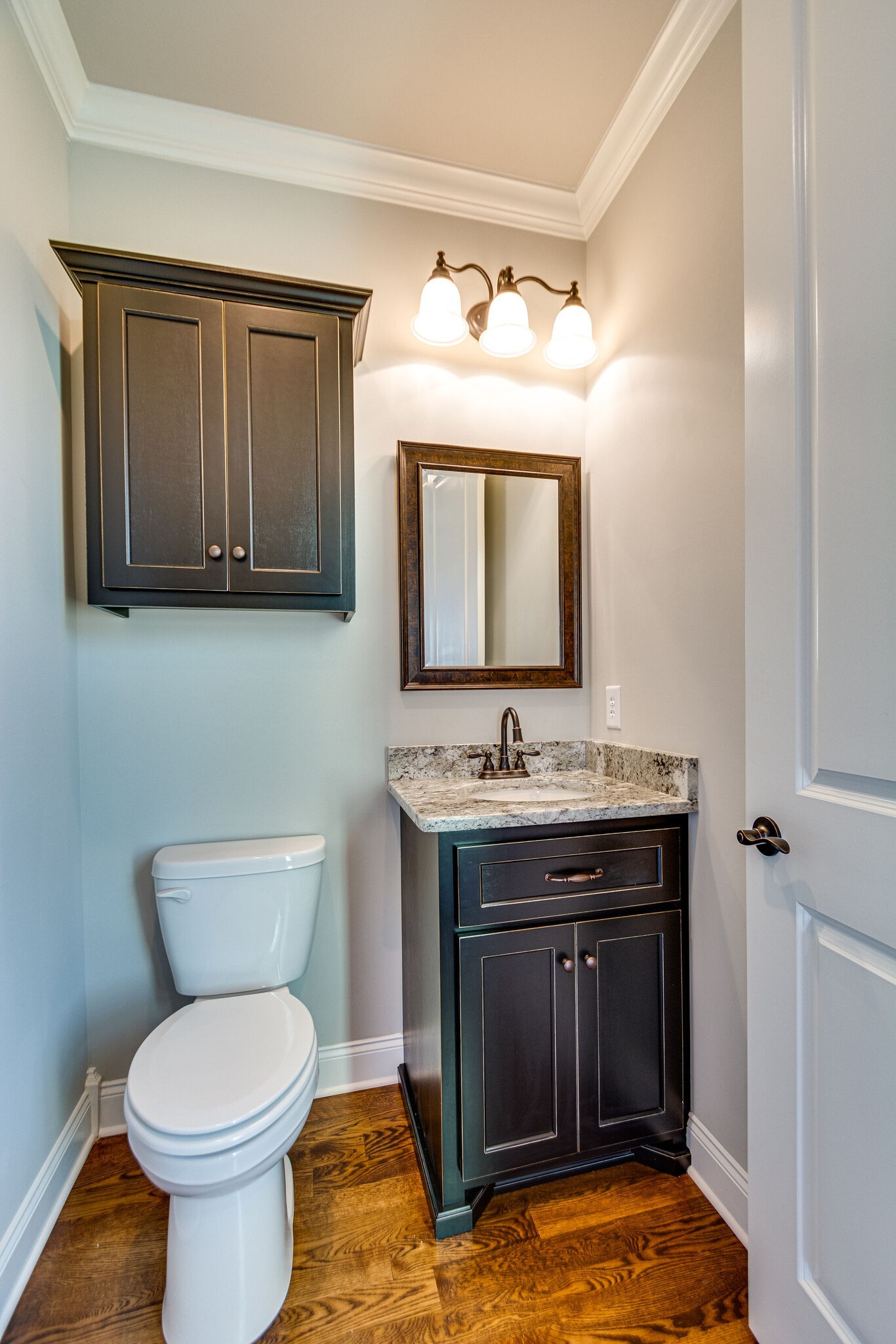 1016 Abbey Rd Way Spring Hill, TN 37174 - Photo 22 of 44 a bathroom with a toilet sink and mirror