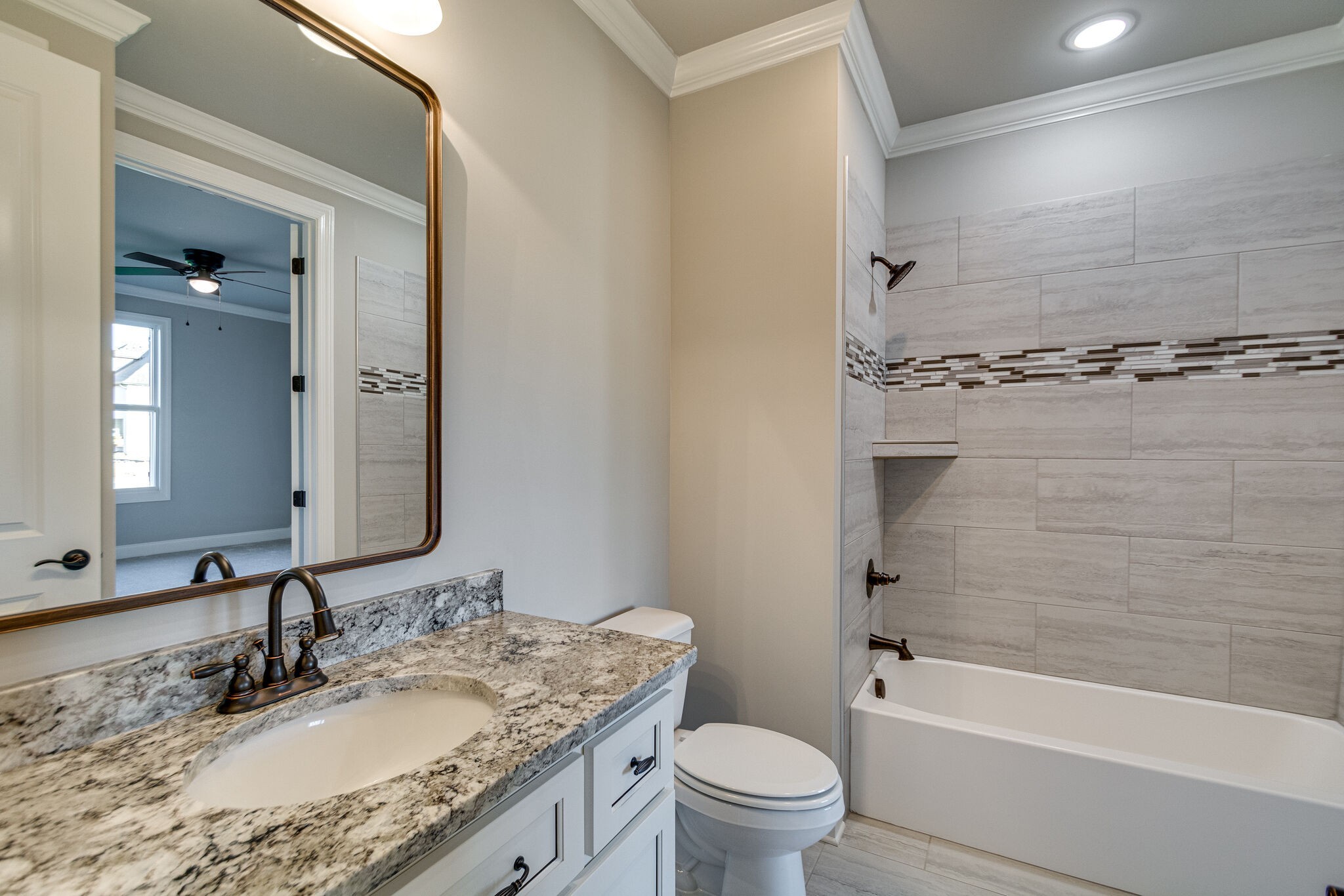 1016 Abbey Rd Way Spring Hill, TN 37174 - Photo 27 of 44 a bathroom with a granite countertop sink a toilet and bathtub
