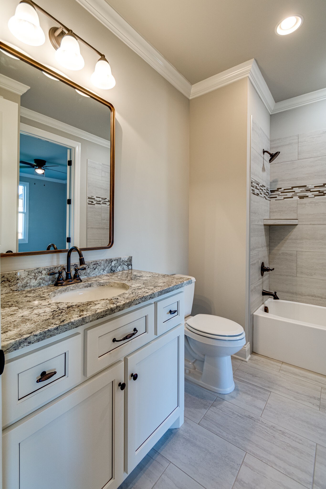 1016 Abbey Rd Way Spring Hill, TN 37174 - Photo 28 of 44 a bathroom with a granite countertop toilet a sink and bathtub