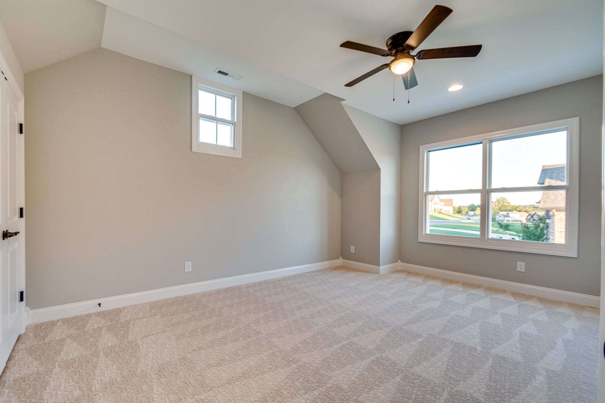 1016 Abbey Rd Way Spring Hill, TN 37174 - Photo 34 of 44 an empty room with ceiling fan and windows