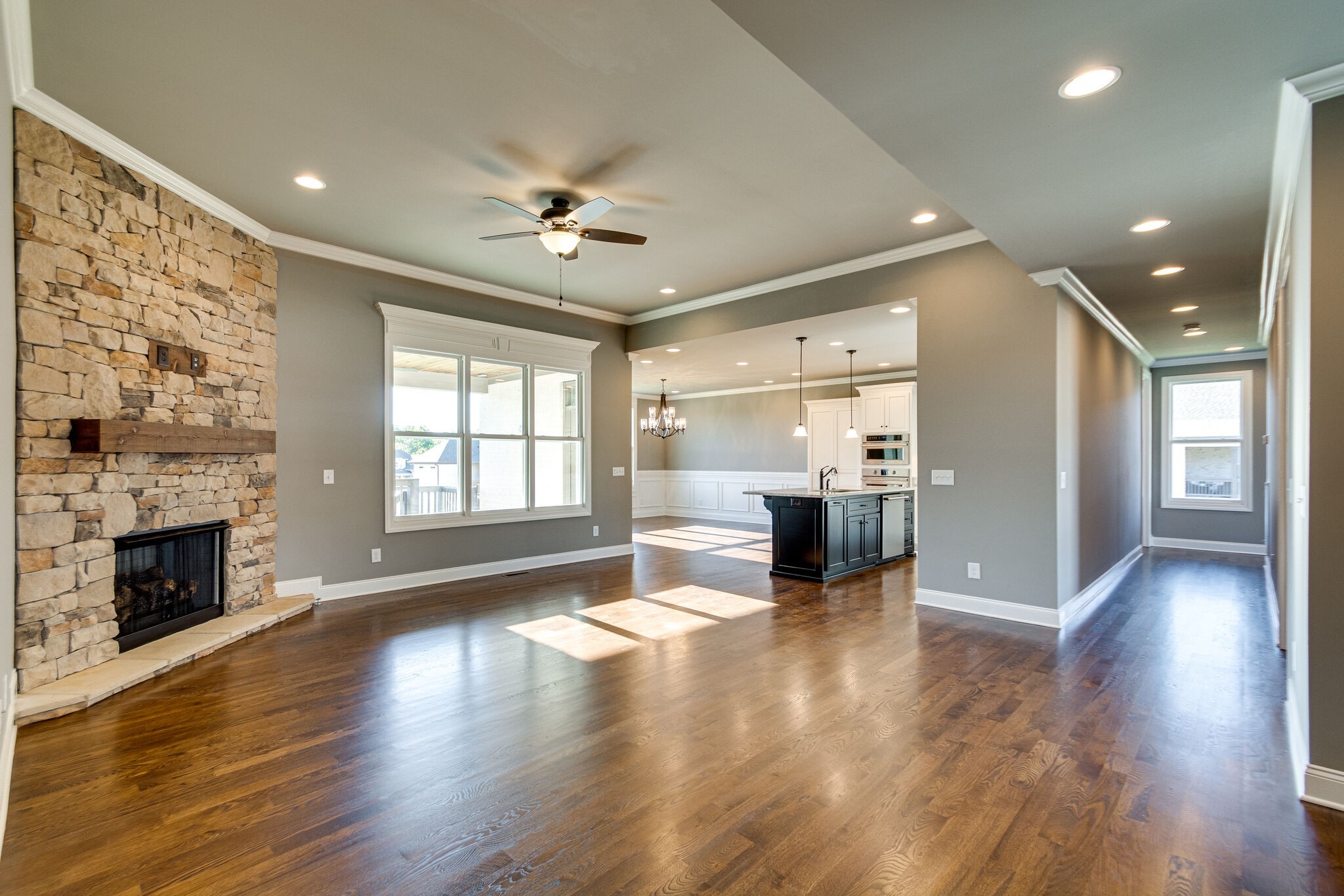 1016 Abbey Rd Way Spring Hill, TN 37174 - Photo 4 of 44 a view of a living room a fireplace with windows and wooden floor