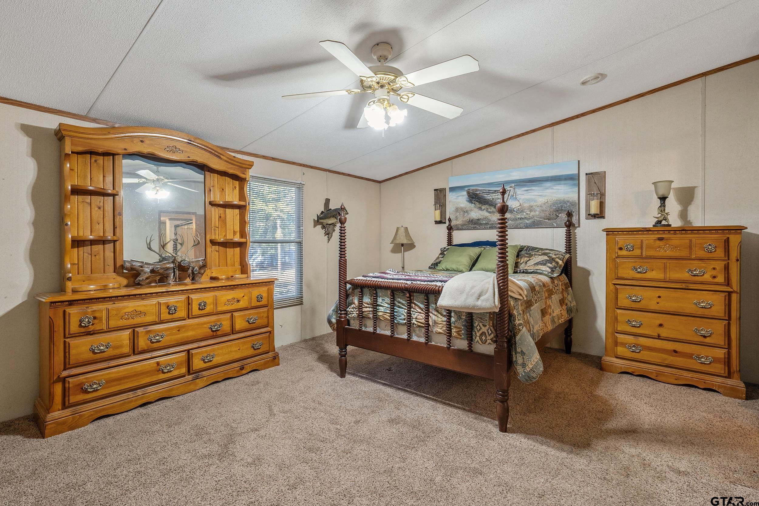 220 Broken Bow Quitman, TX 75783 - Photo 15 of 28 a bedroom with a bed and a dresser
