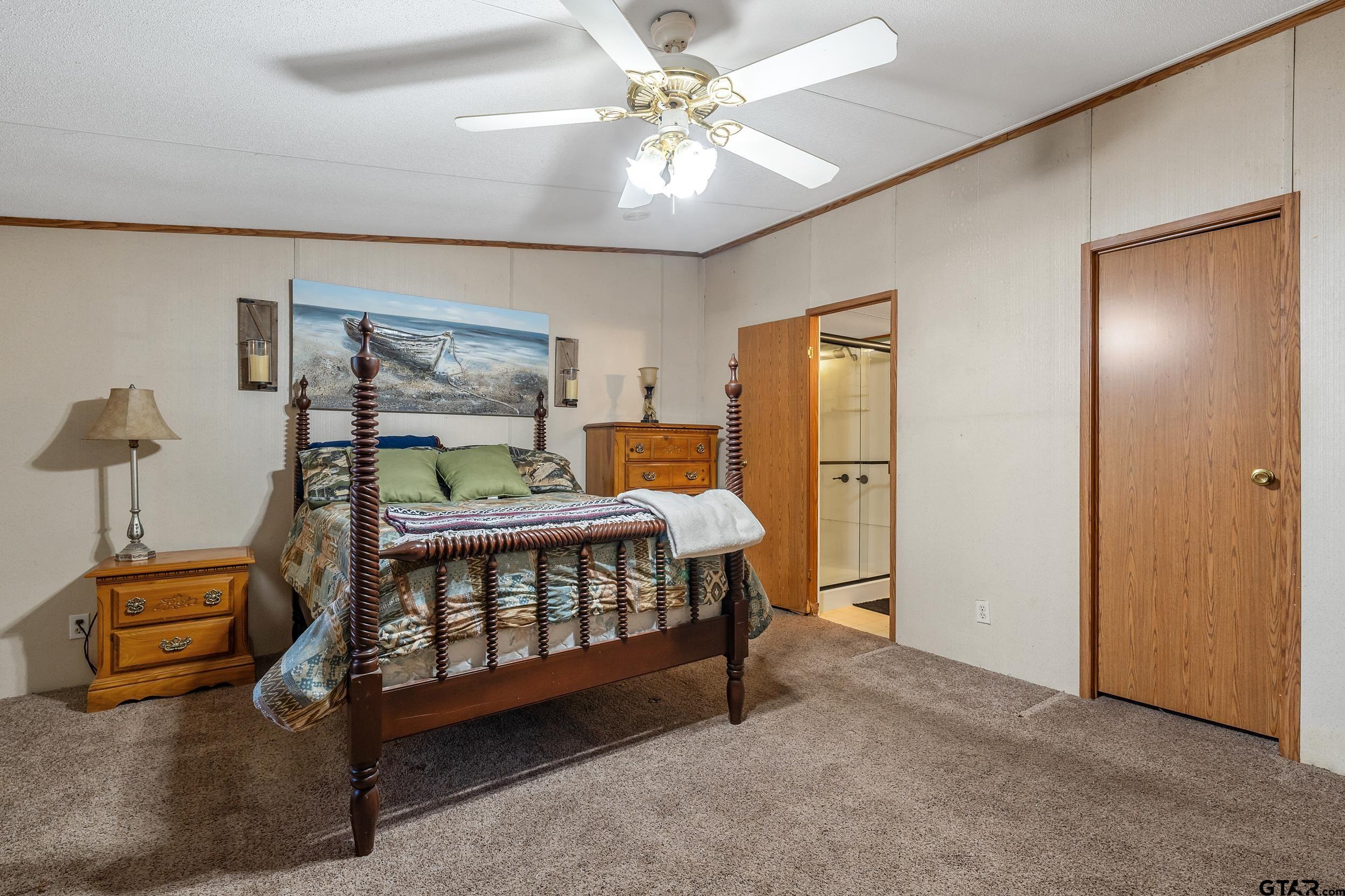 220 Broken Bow Quitman, TX 75783 - Photo 16 of 28 a bedroom with furniture and a window