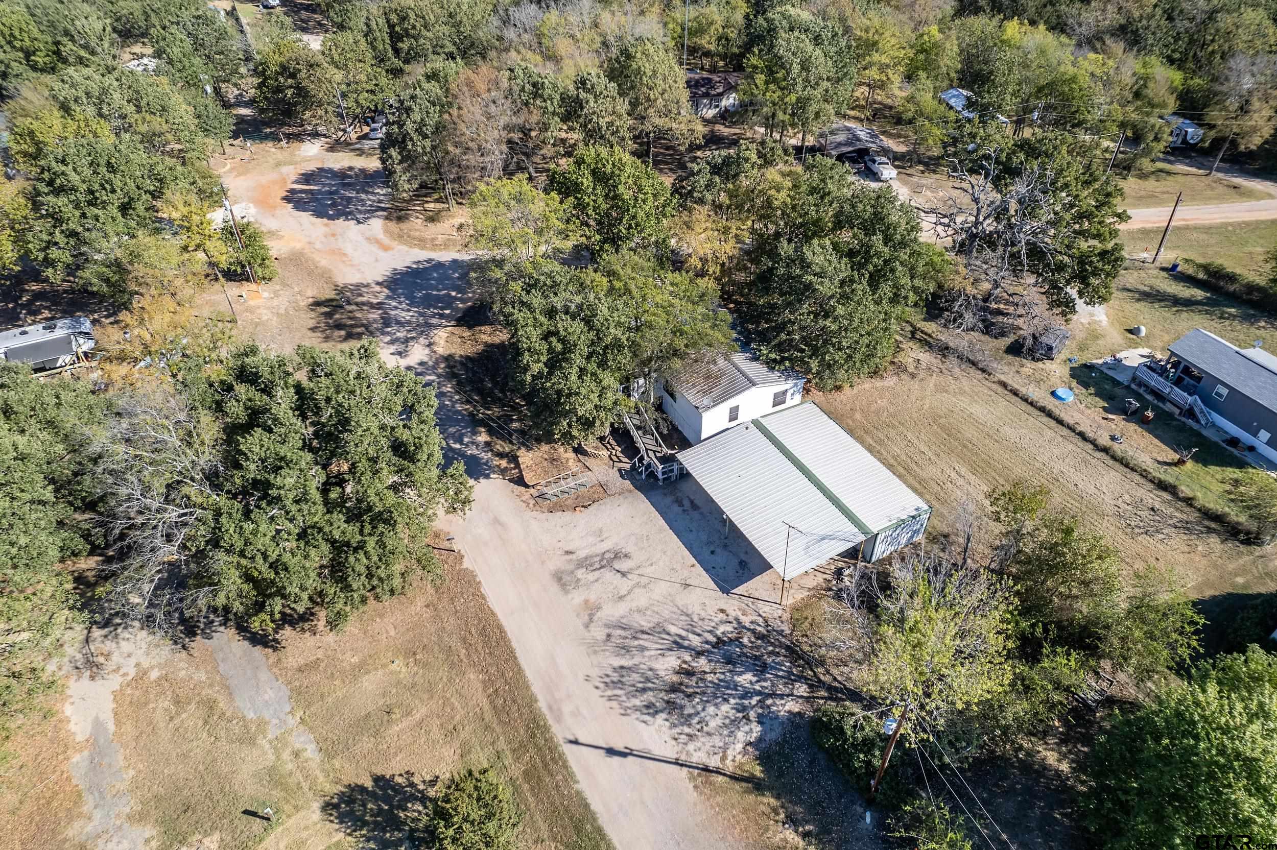 220 Broken Bow Quitman, TX 75783 - Photo 20 of 28 a view of a yard with wooden fence