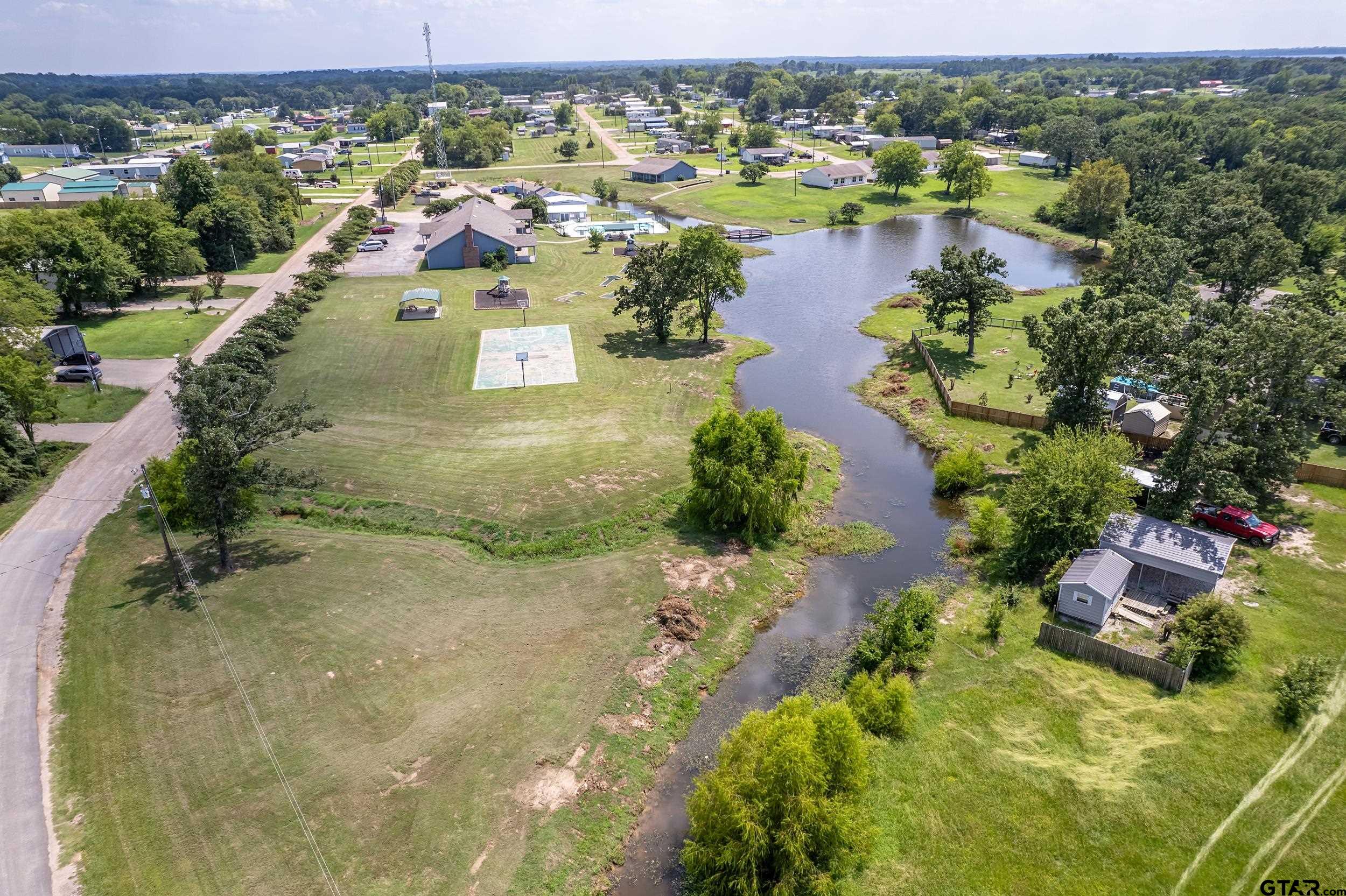 220 Broken Bow Quitman, TX 75783 - Photo 23 of 28 an aerial view of residential houses with outdoor space